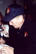 Good Old James, quickly signing autographs before dashing off to Shreveport.